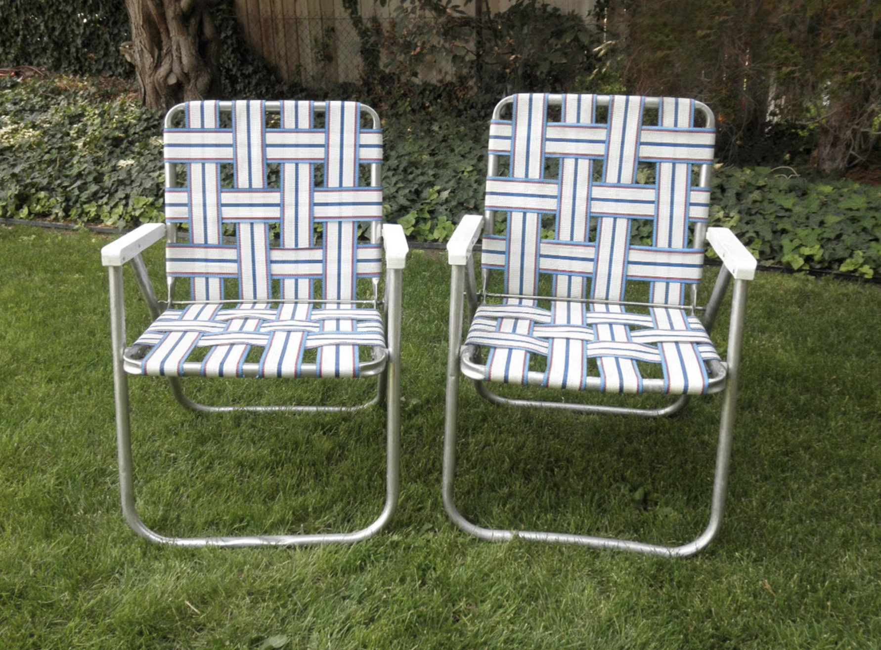 Two webbed folding patio chairs