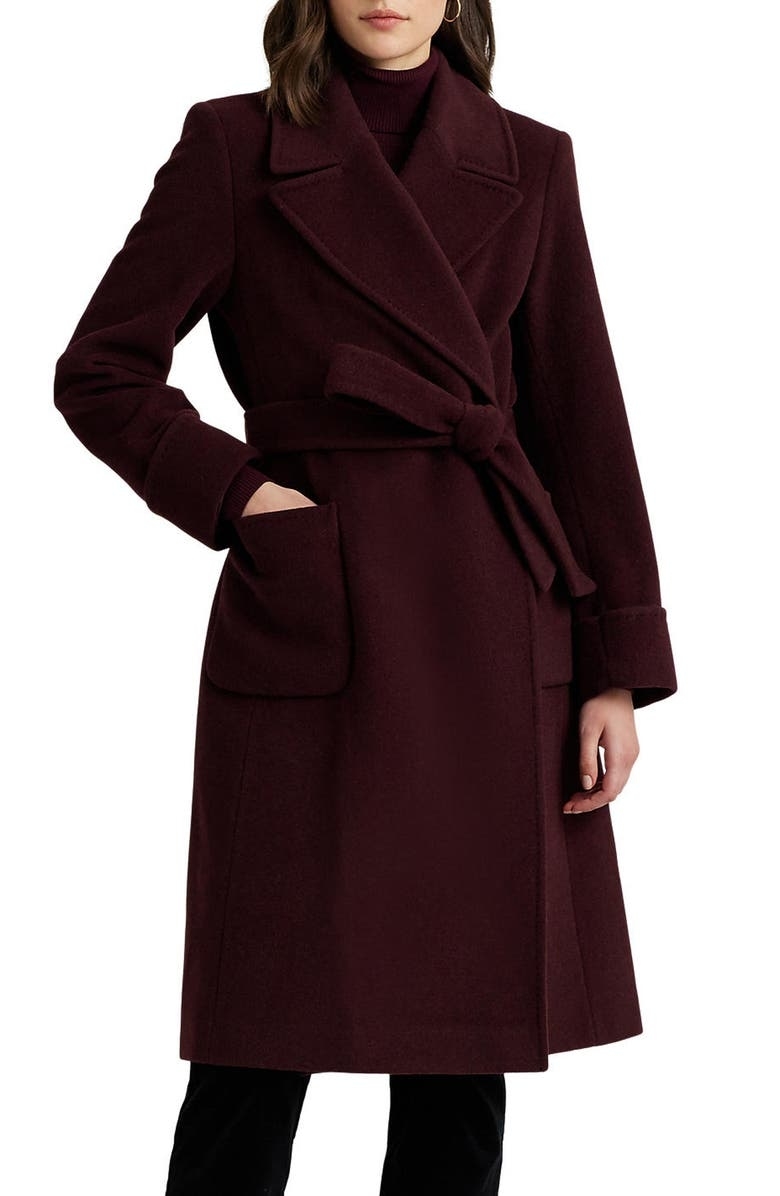 a model wearing the coat in burgundy