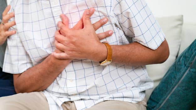 man holding chest in pain