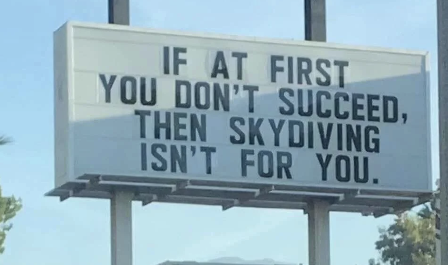 marquee sign reads, if at first you don&#x27;t succeed then skydiving isn&#x27;t for you