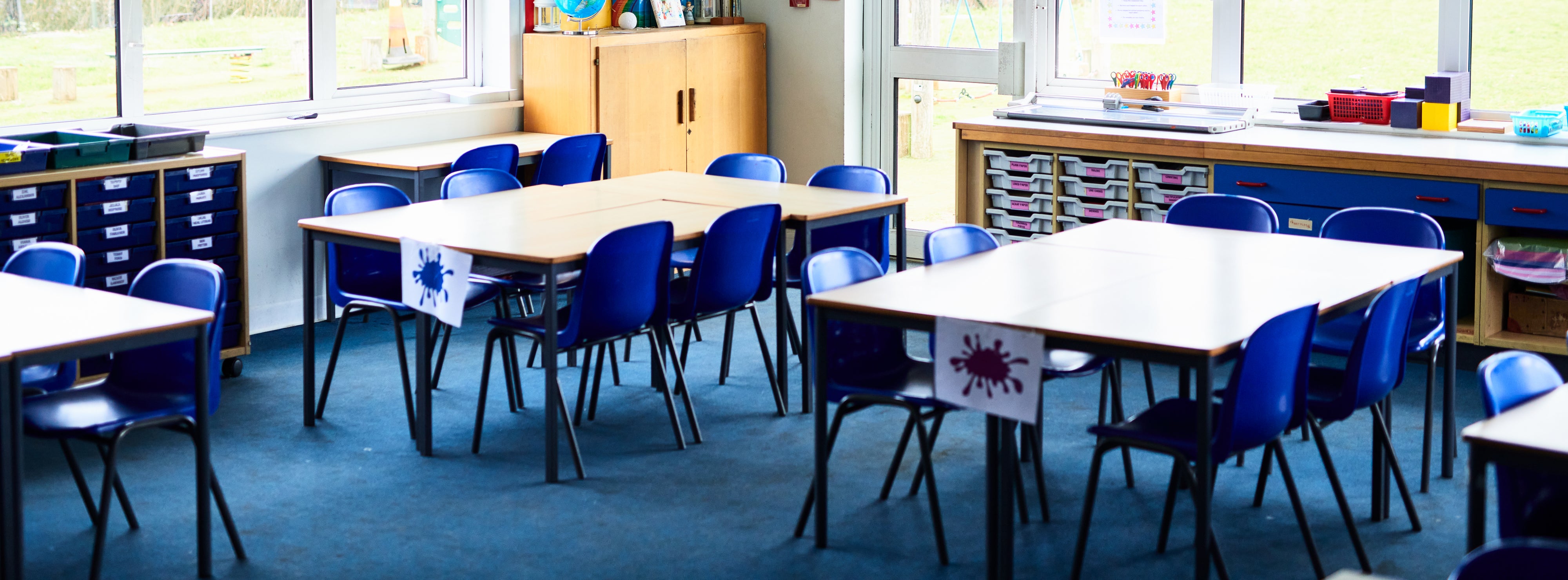 Tidy tables and chairs arranged in school class room