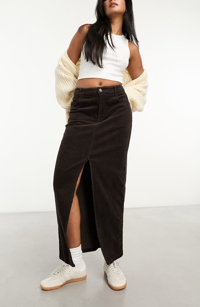 a model wearing the brown skirt