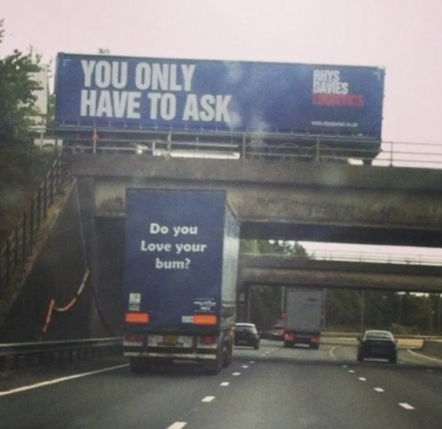 back of a semi truck reads do you love your bum