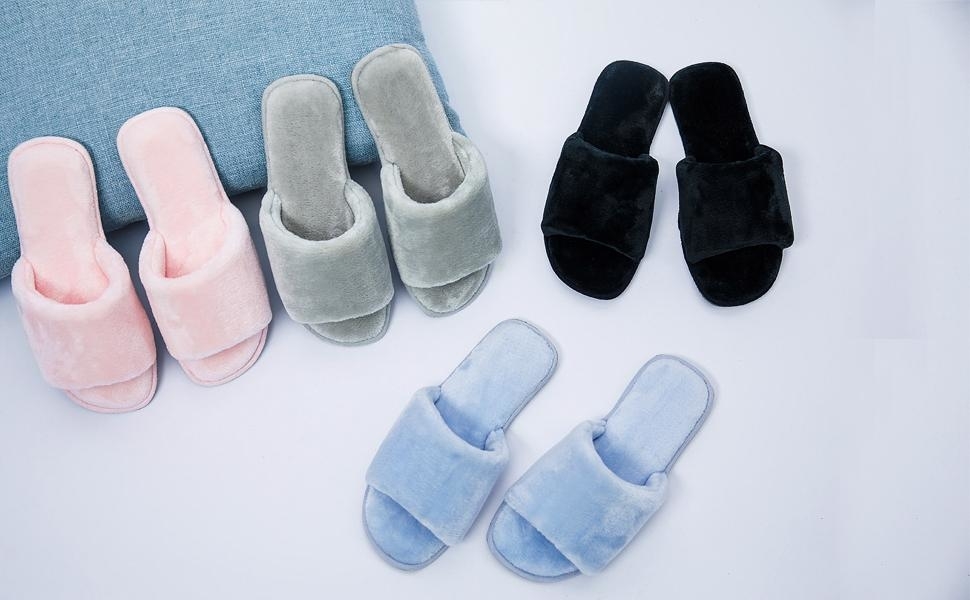 The slippers in light pink, grey, black, and light blue