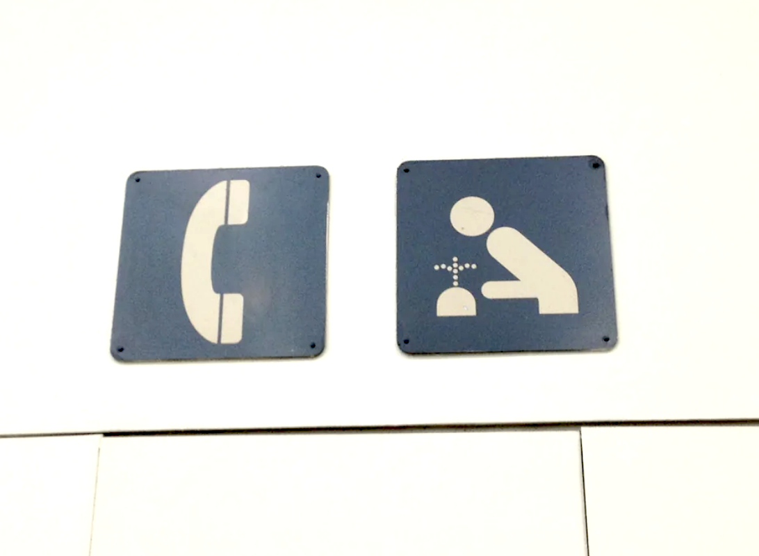 sign could be interpreted as a crude drawing of drinking water