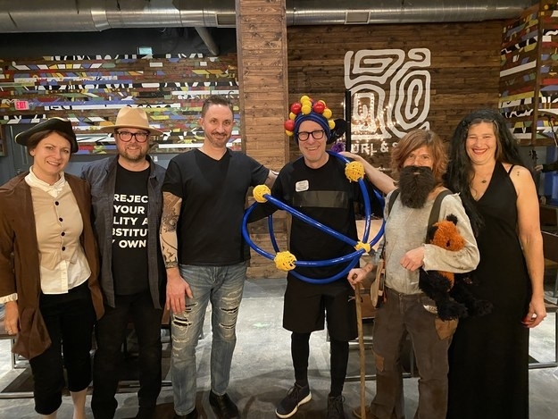 People dressed like atoms, Adams, and Addams