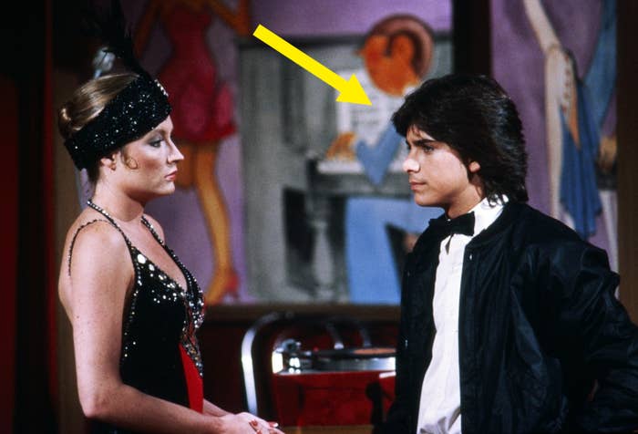 John in a tuxedo standing next to a woman in a scene &quot;General Hospital&quot;
