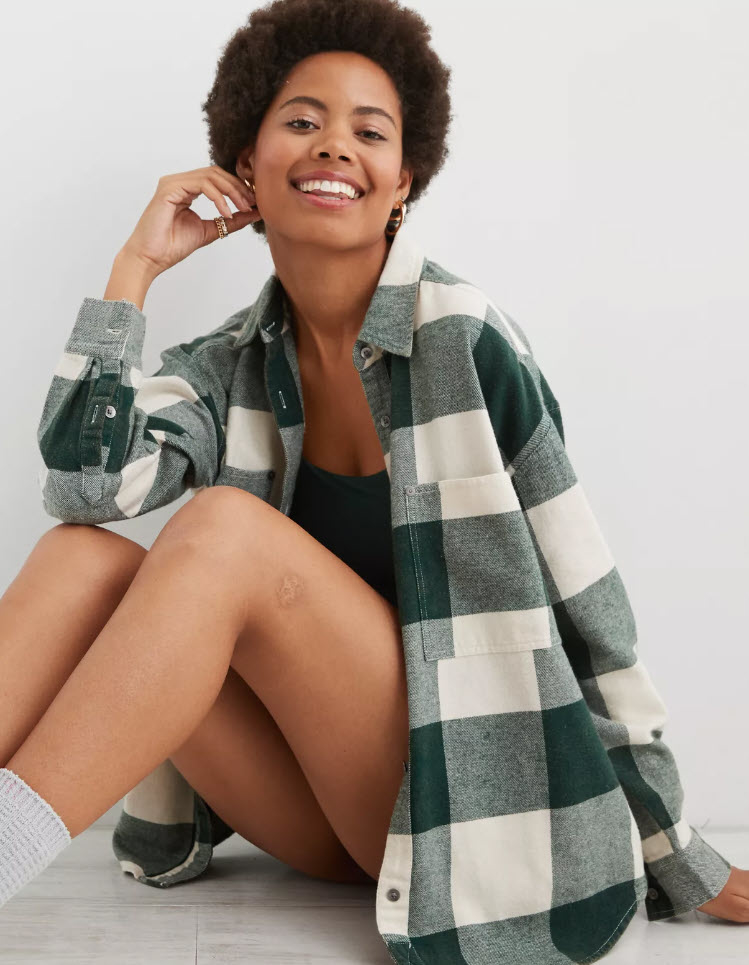 model wearing dark green and white checkered flannel