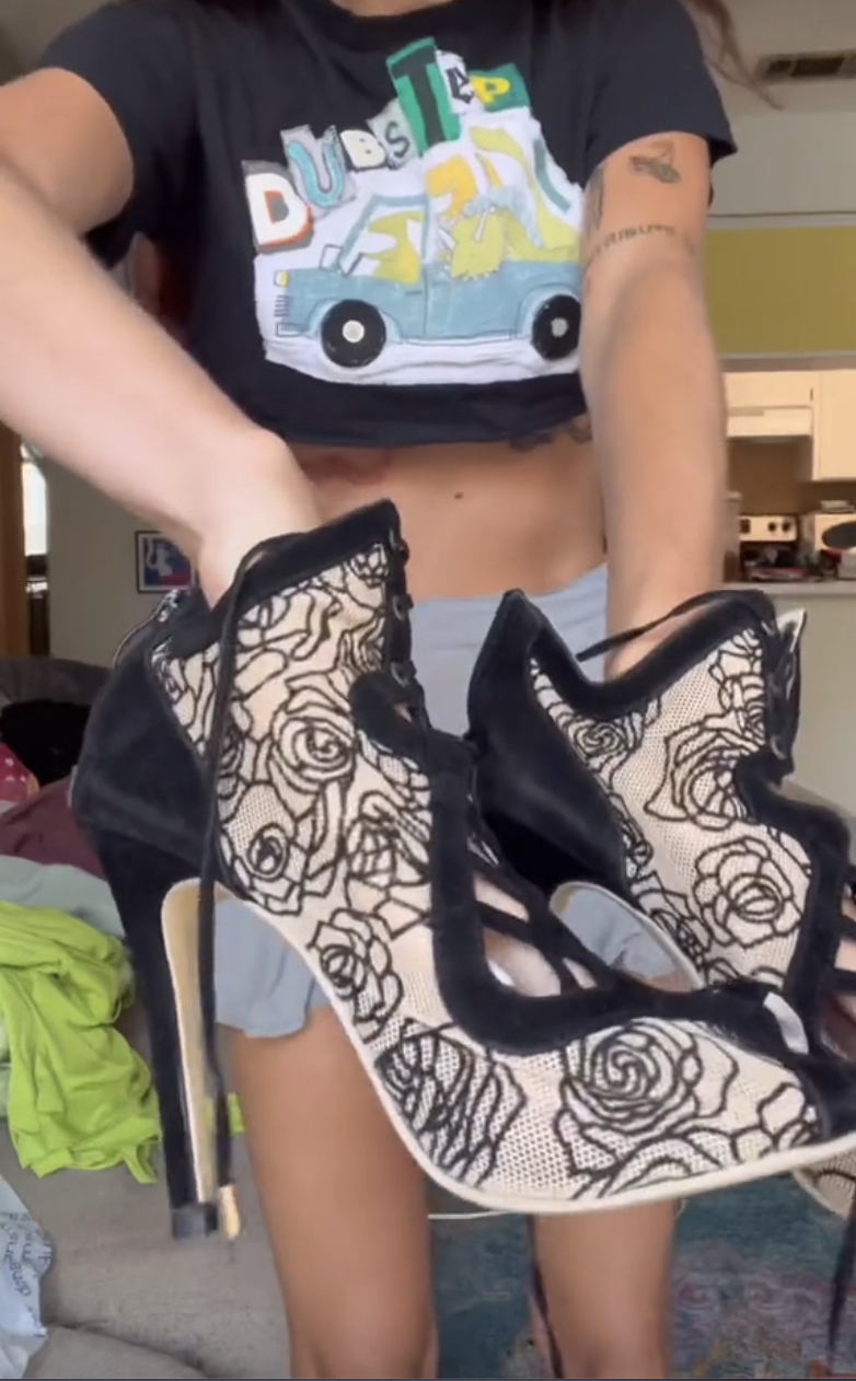 The shoes have a rose design, but one of them is missing the heel