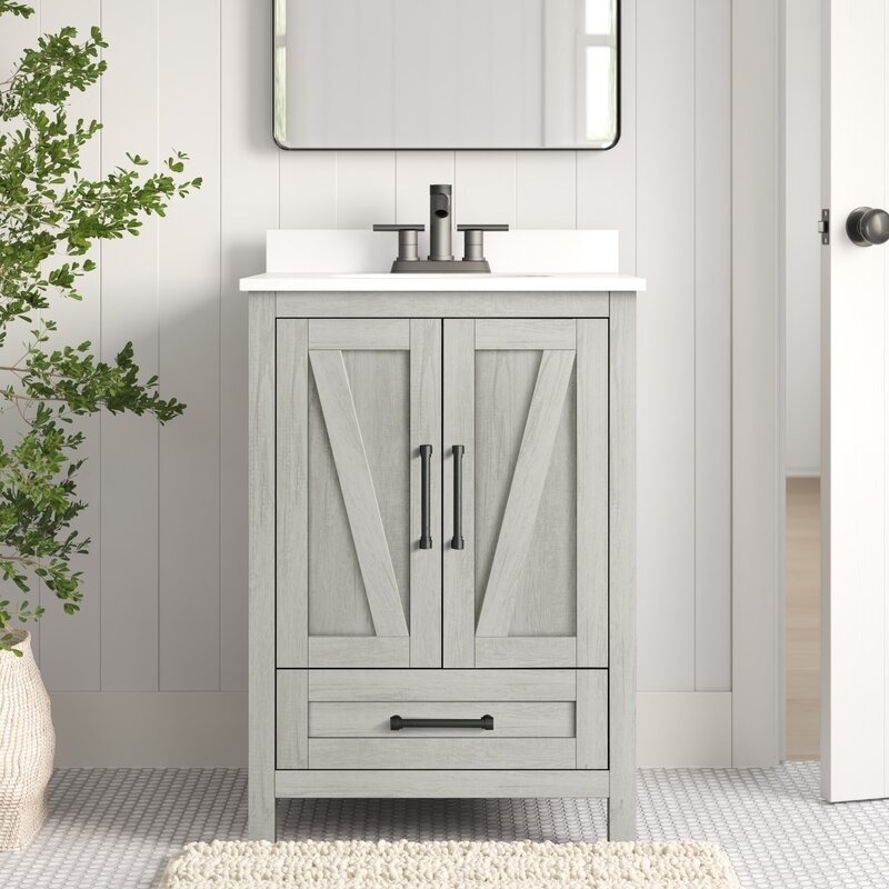 white bathroom vanity with cabinet and drawer space