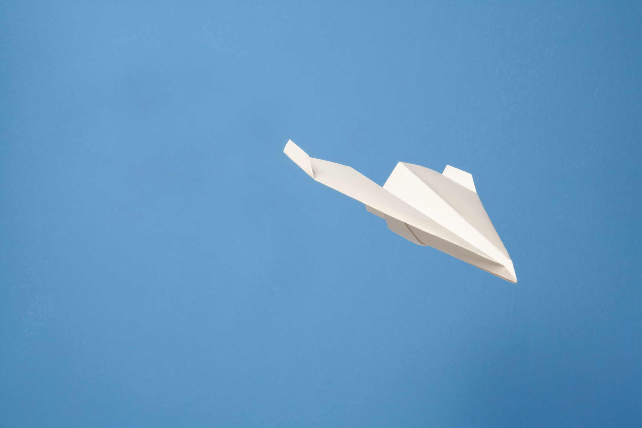 A flying paper airpkane