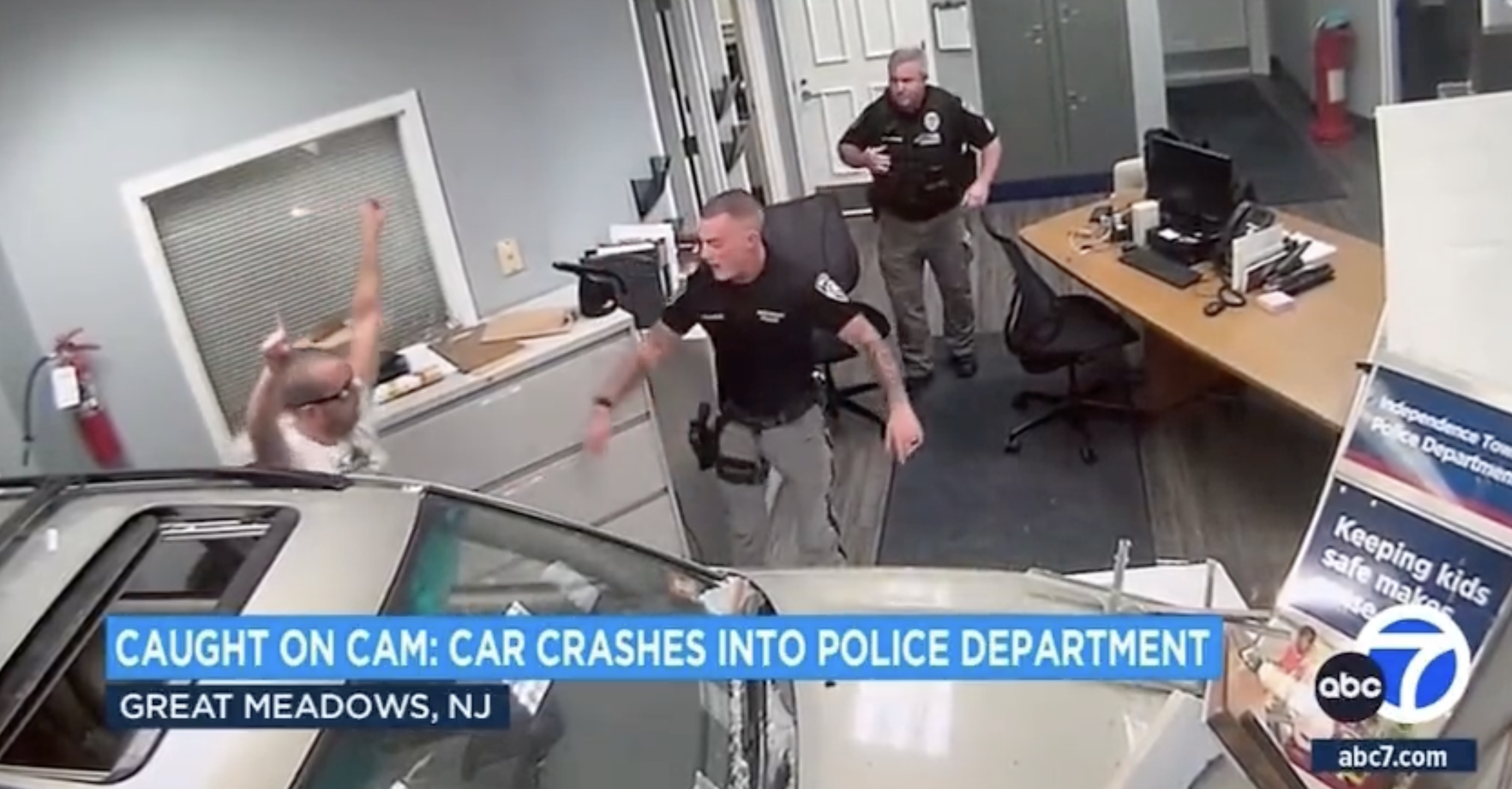 "Car crashes into police department"