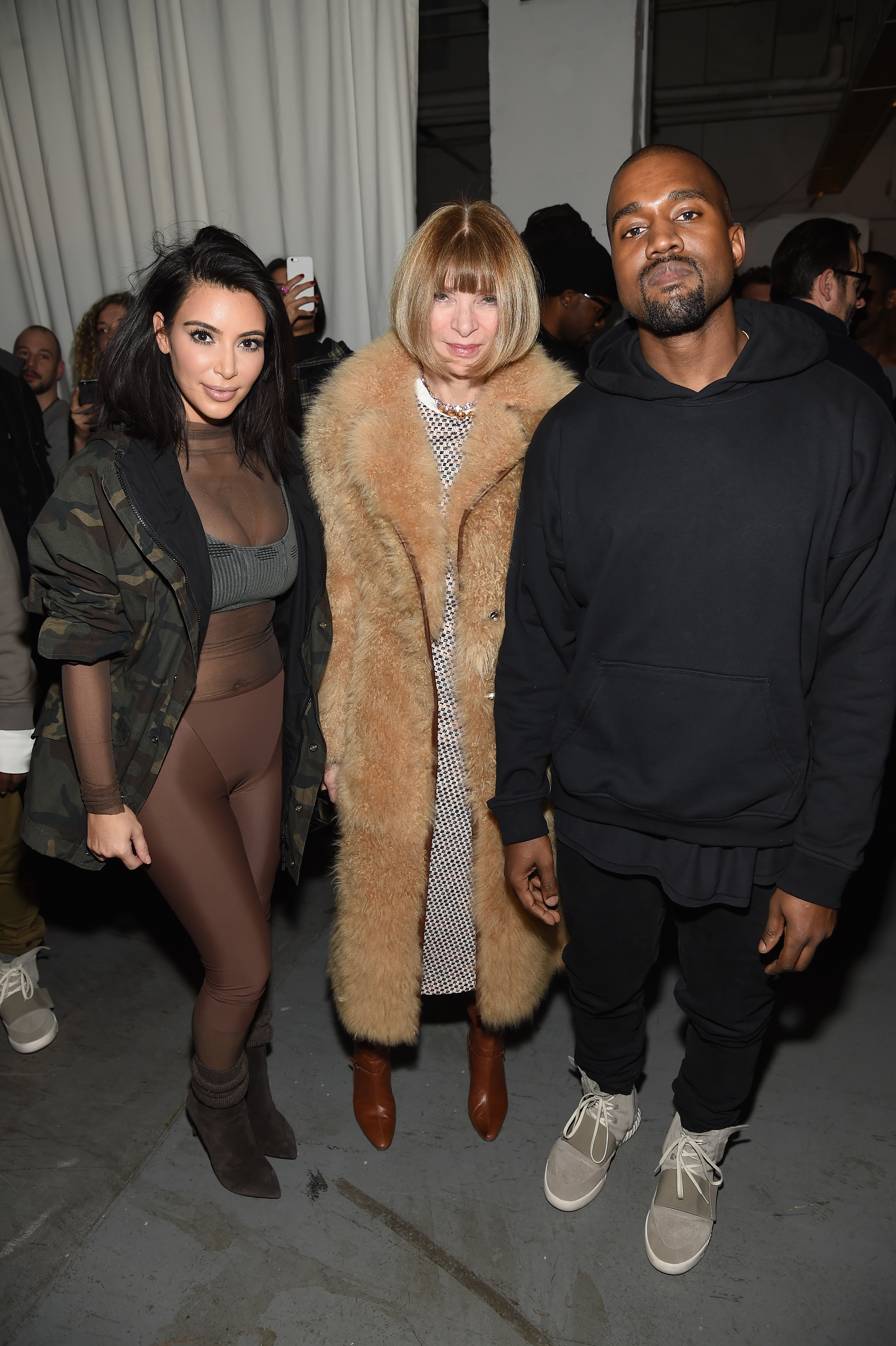 Closeup of Kim Kardashian, Anna Wintour, and Kanye West