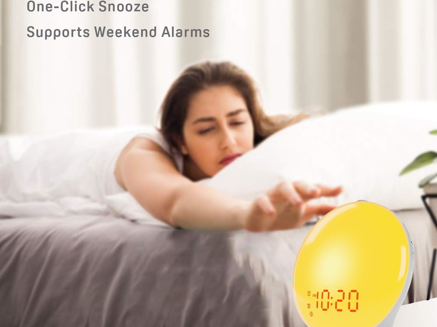 a woman reaching for a sunlight alarm clock