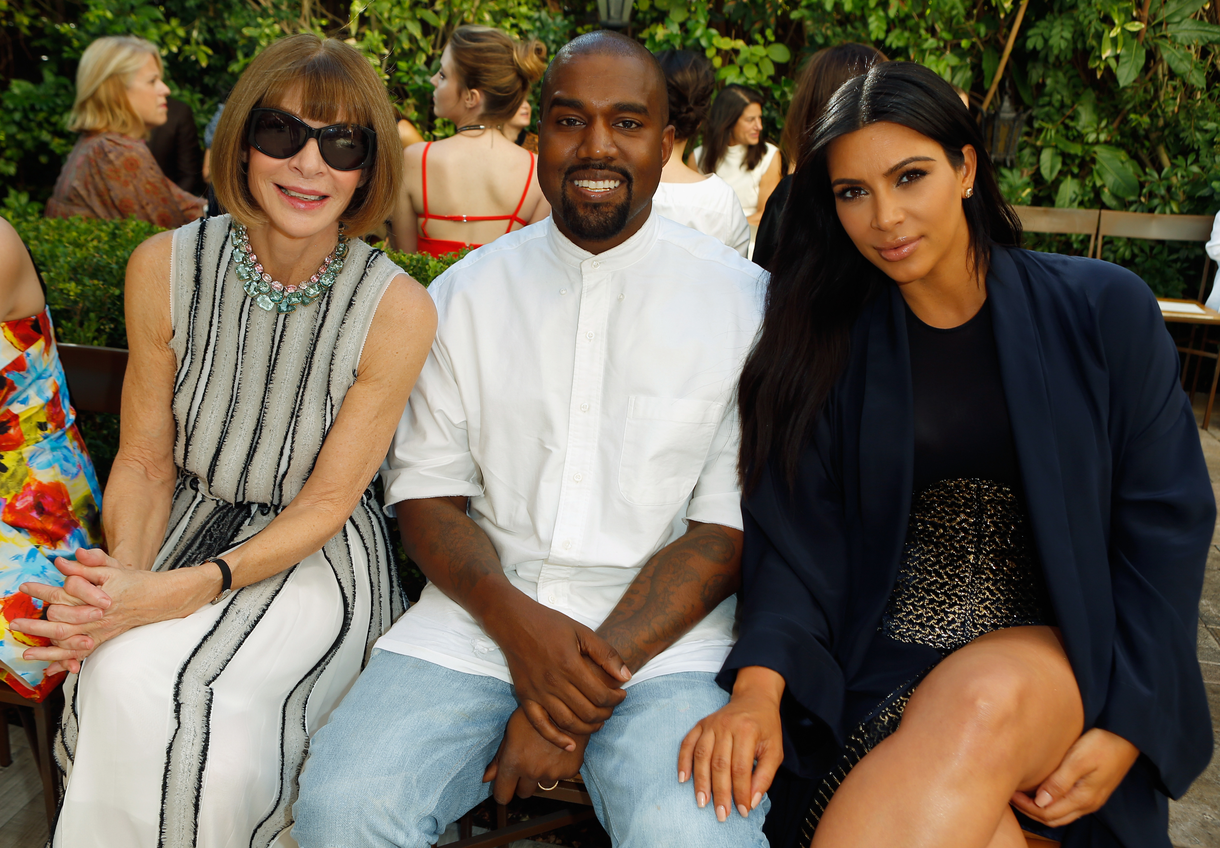 Closeup of Anna Wintour, Kanye West, and Kim Kardashian