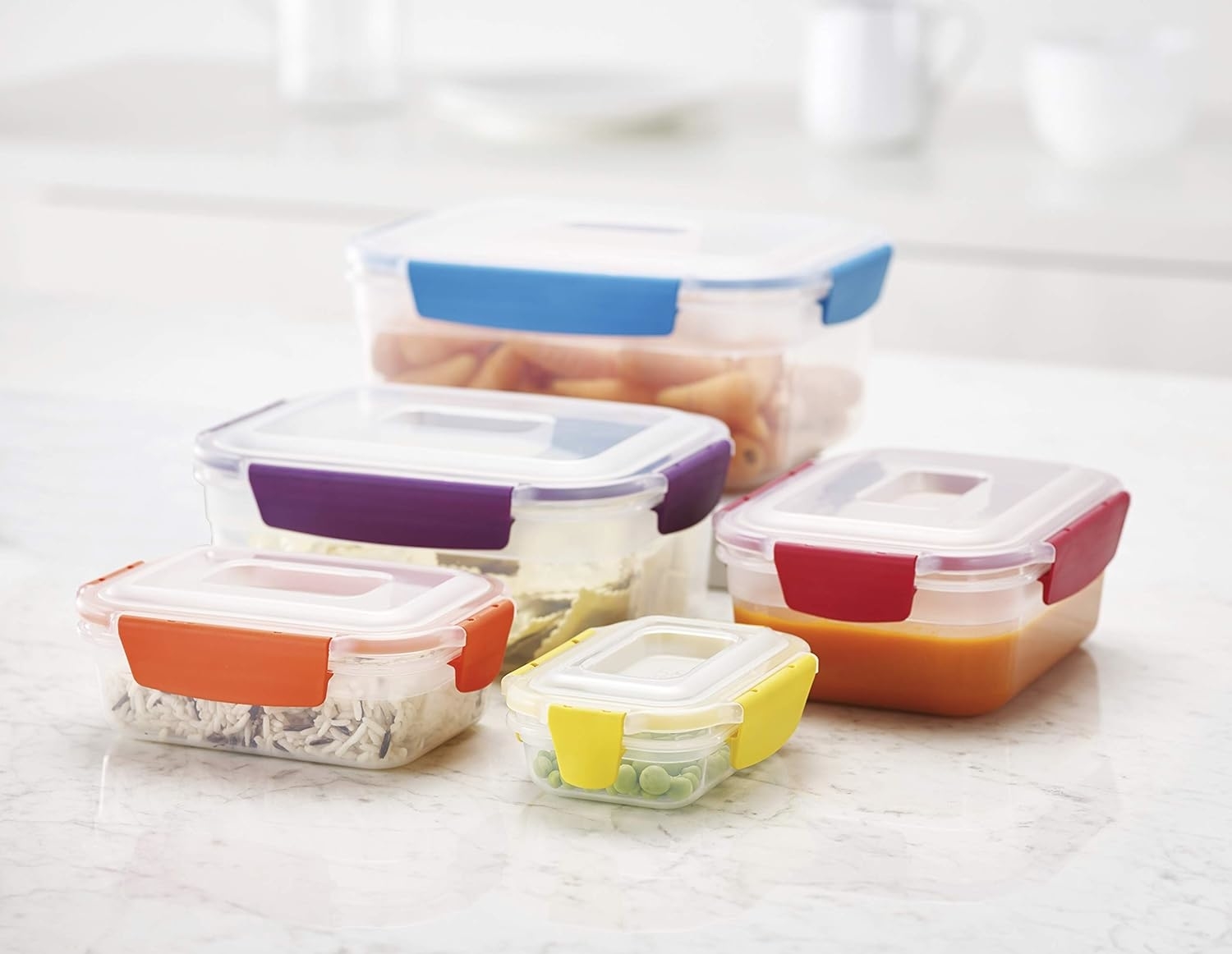 Various containers holding food and topped with colorful lids