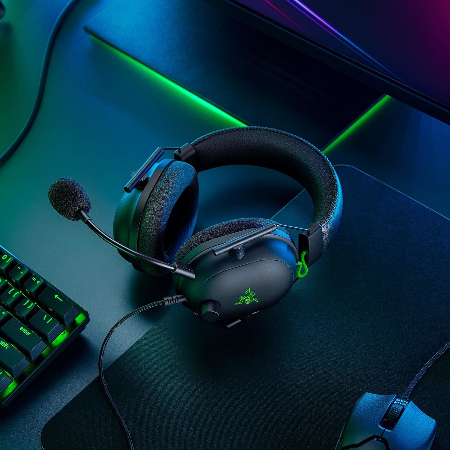 a black and green gaming headset