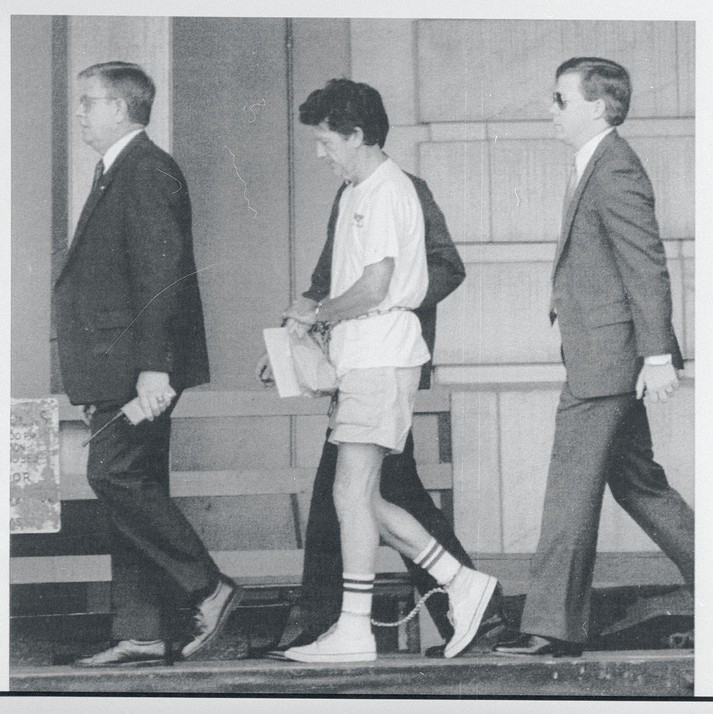 Walter Moody being led to court
