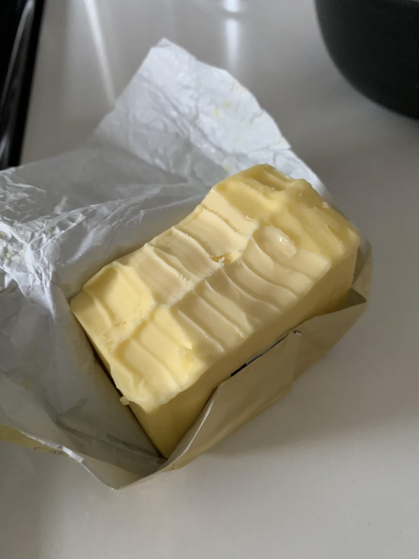 Block of butter with tooth marks in it