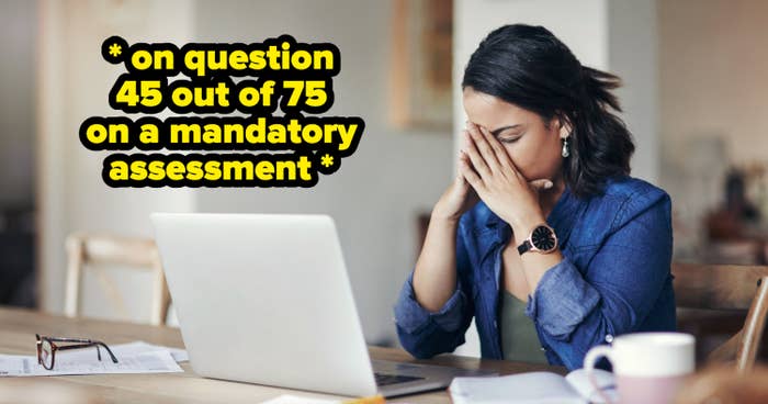 Shot of a young woman looking stressed while using a laptop
