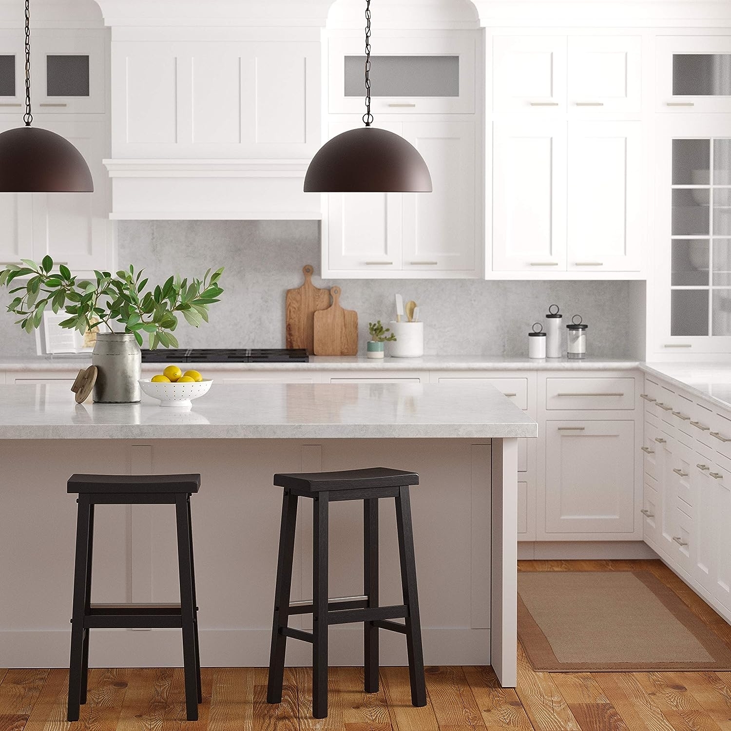 Two black wood barstools at a kitchen counter