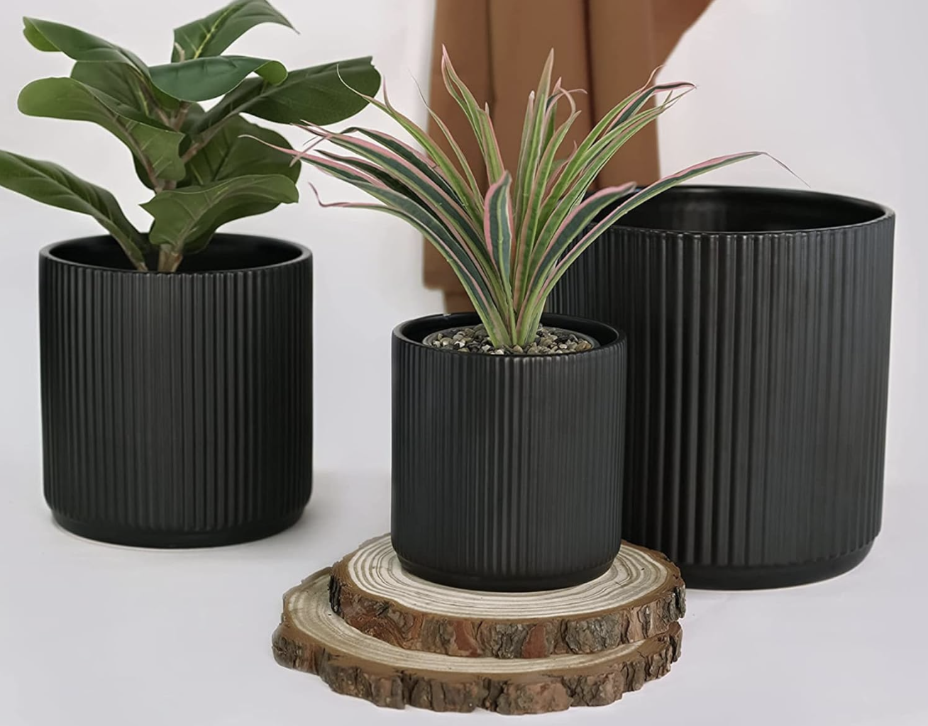 The three fluted black planters in different sizes