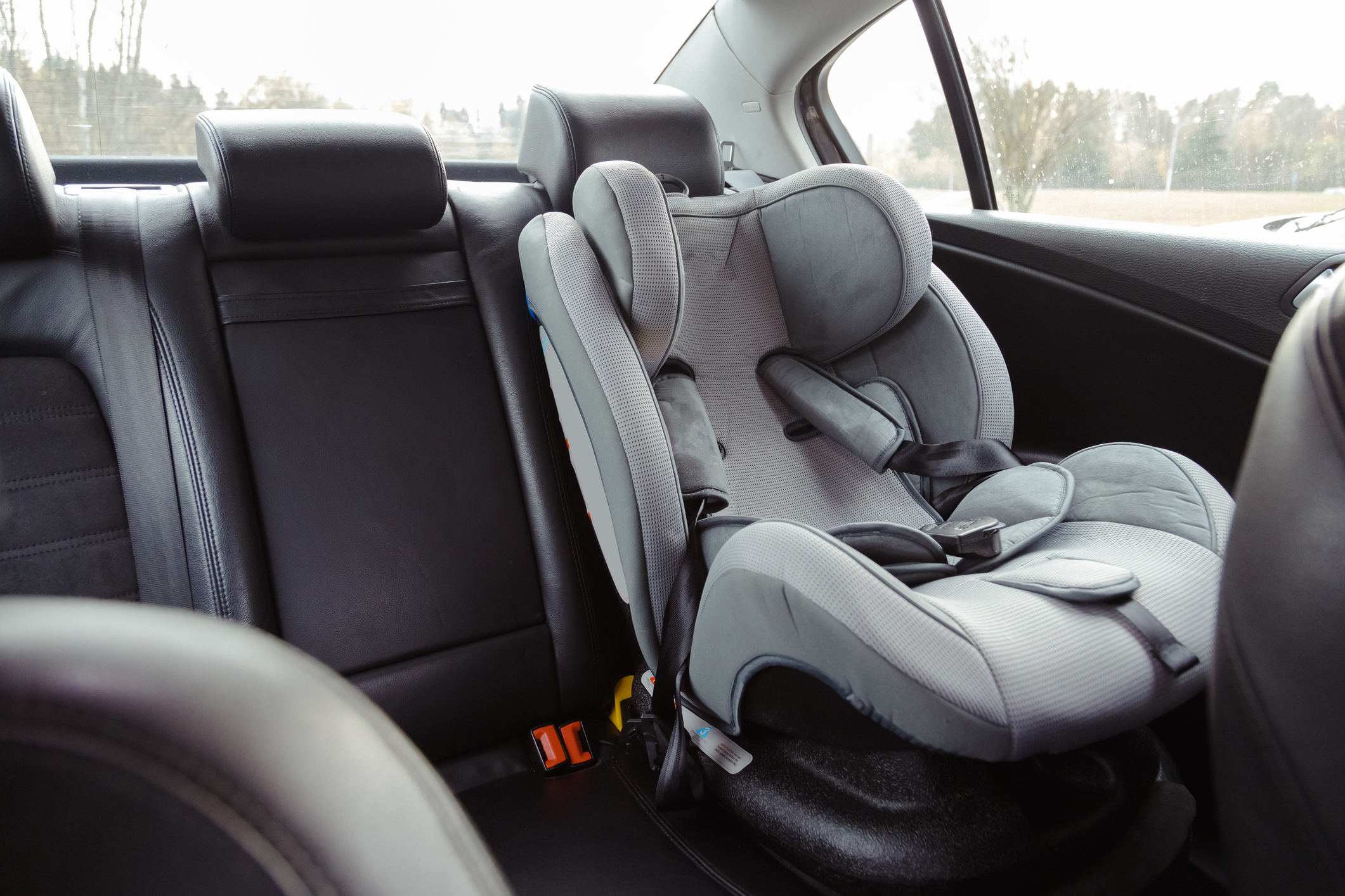 A baby&#x27;s carseat in the backseat of a car