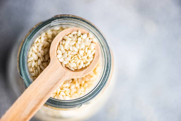 Spoonful of white sesame seeds