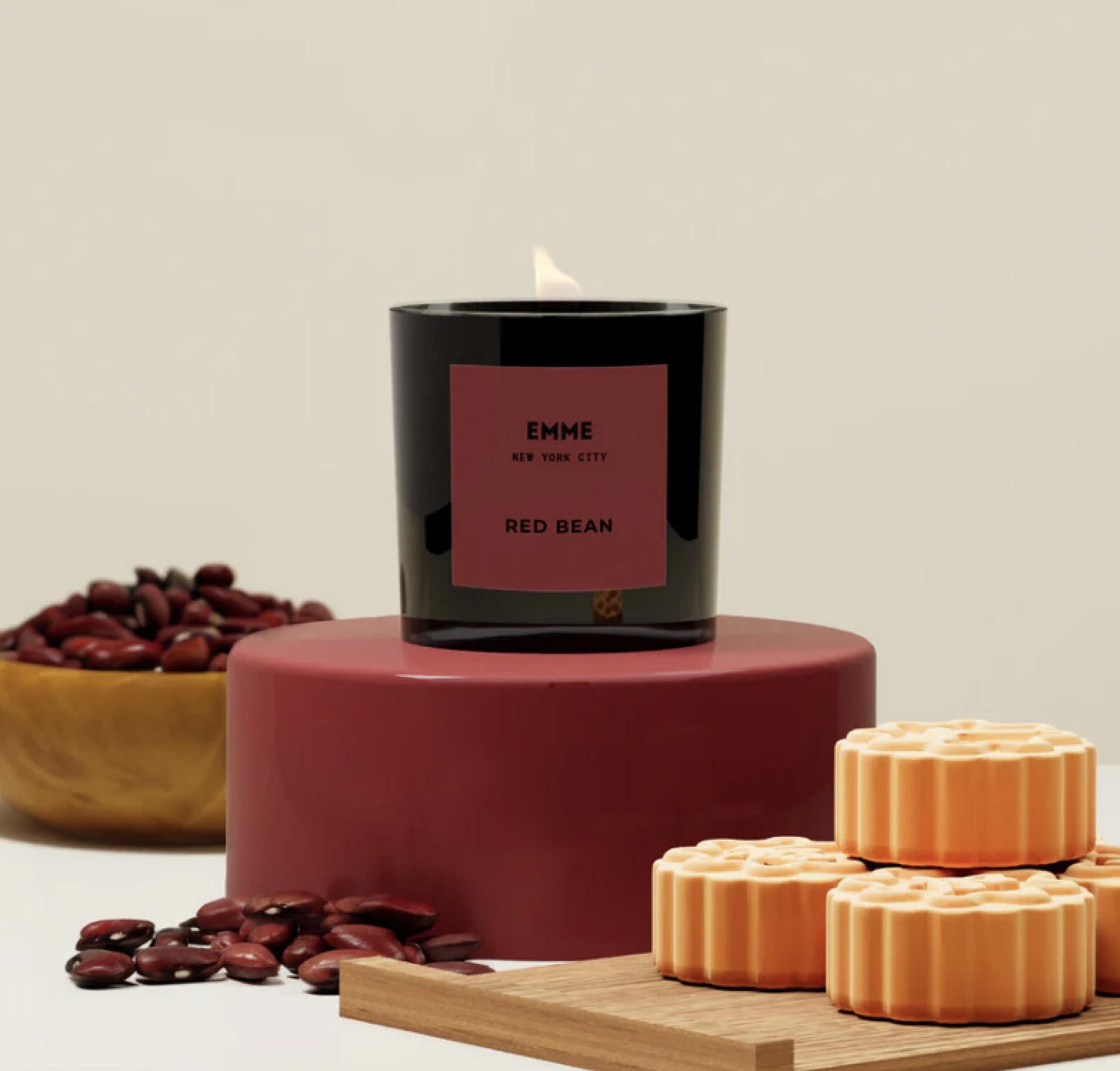 Red Bean scented candle next to mooncakes