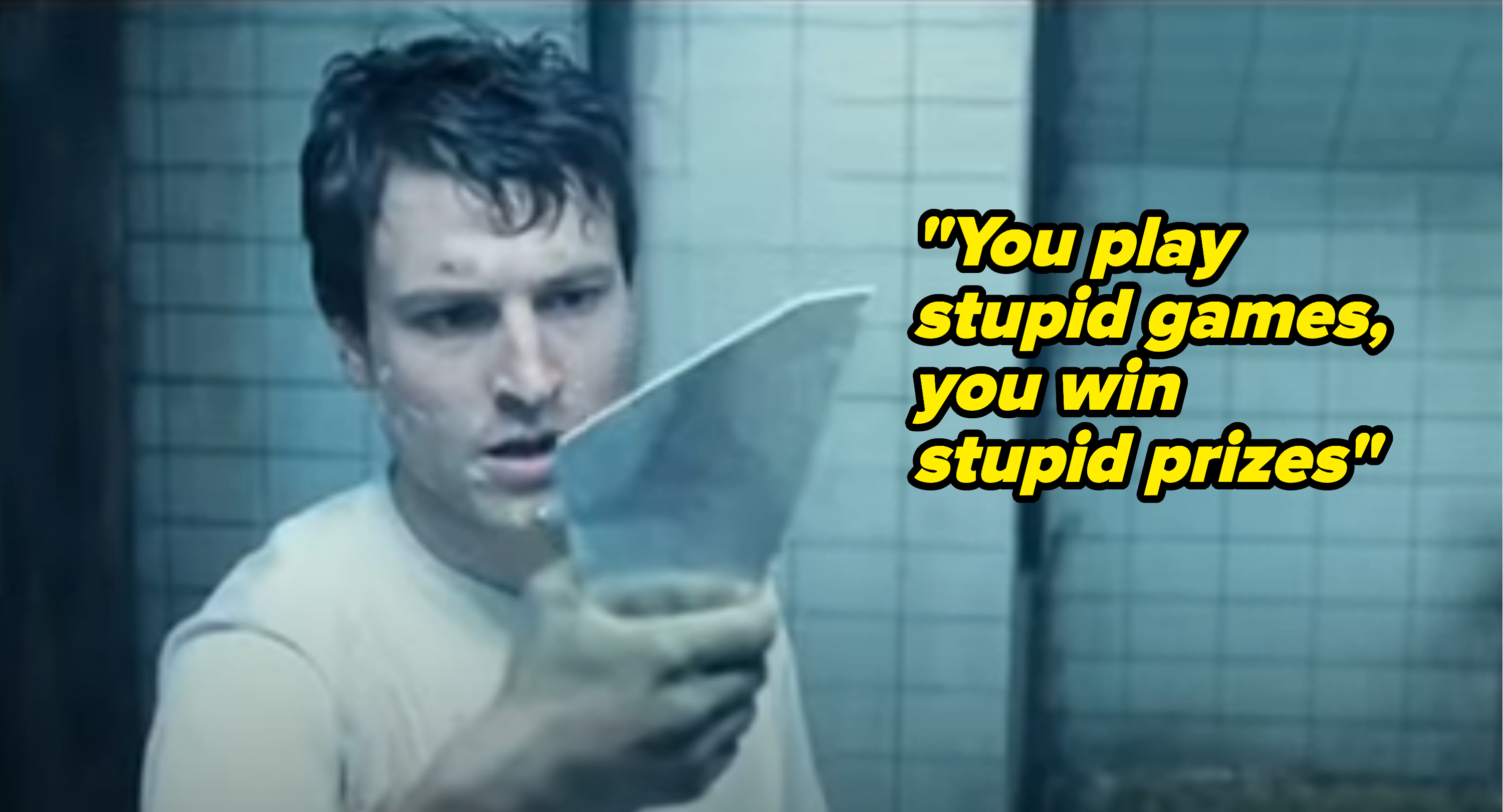 actor holding up mirror shard in saw with taylor lyrics &#x27;you play stupid games you win stupid prizes&#x27;