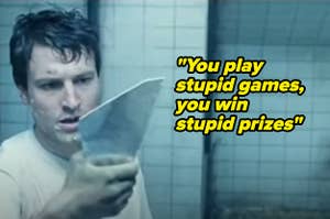 actor holding up mirror shard in saw with taylor lyrics 'you play stupid games you win stupid prizes'