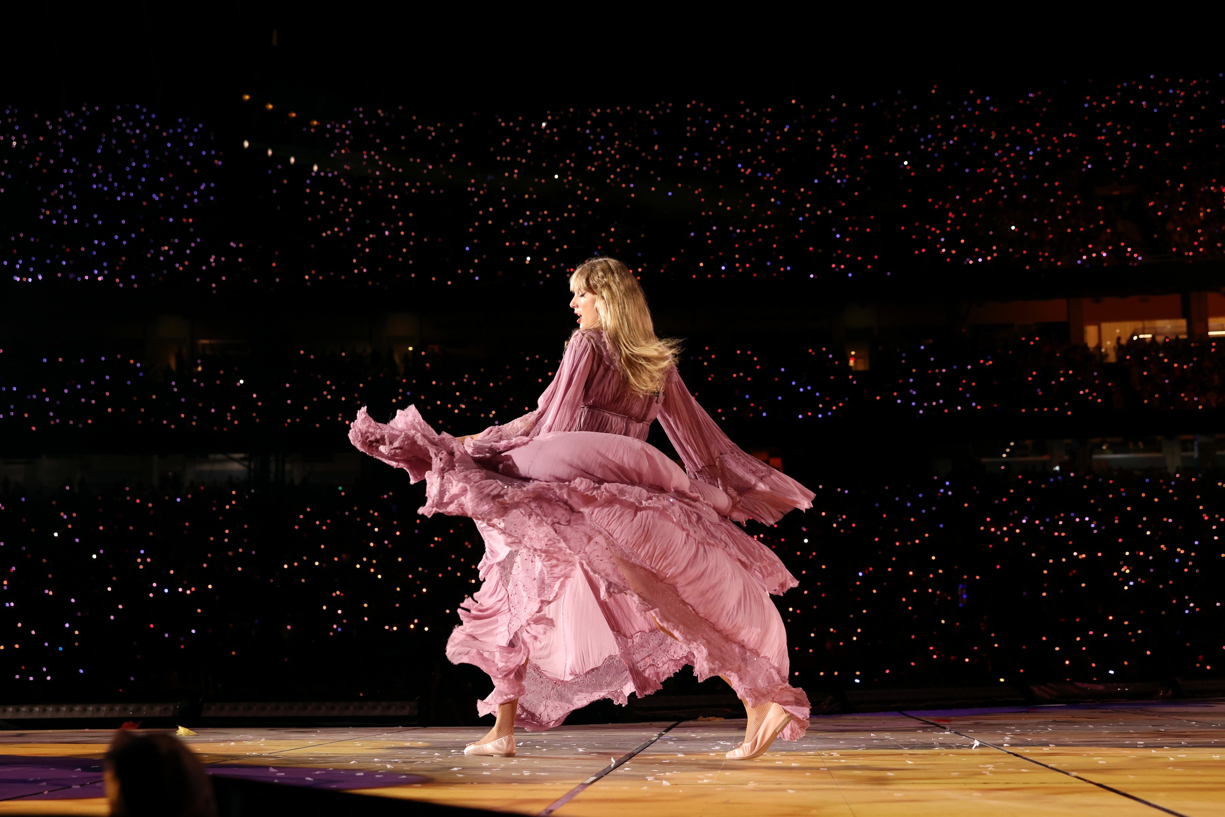 Taylor onstage in a large stadium