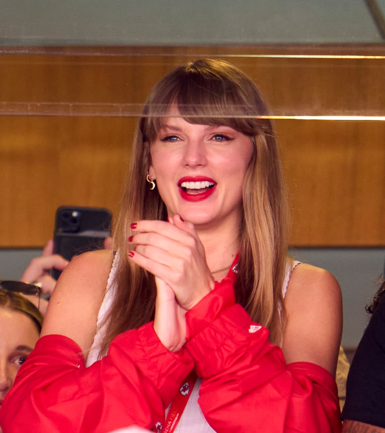 Close-up of Taylor applauding