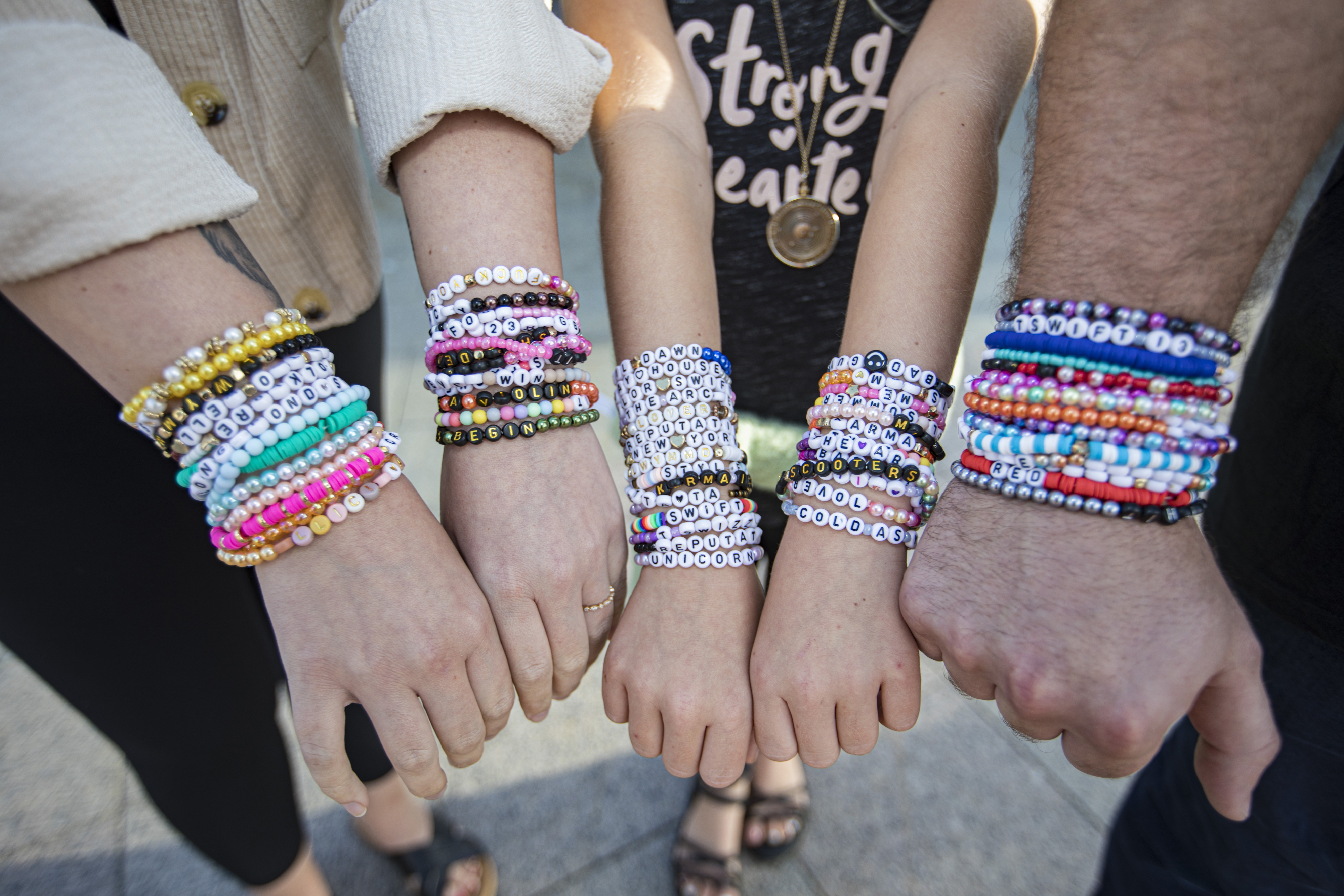 Fans wearing friendship bracelets