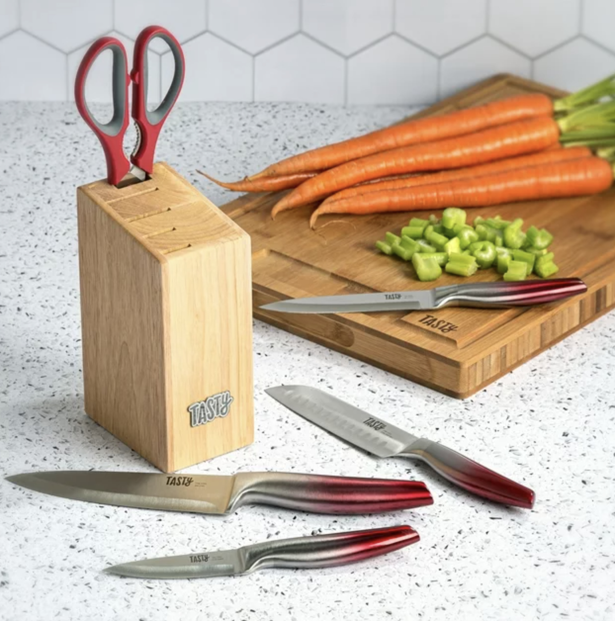 The knife block set on counter with knives spread out