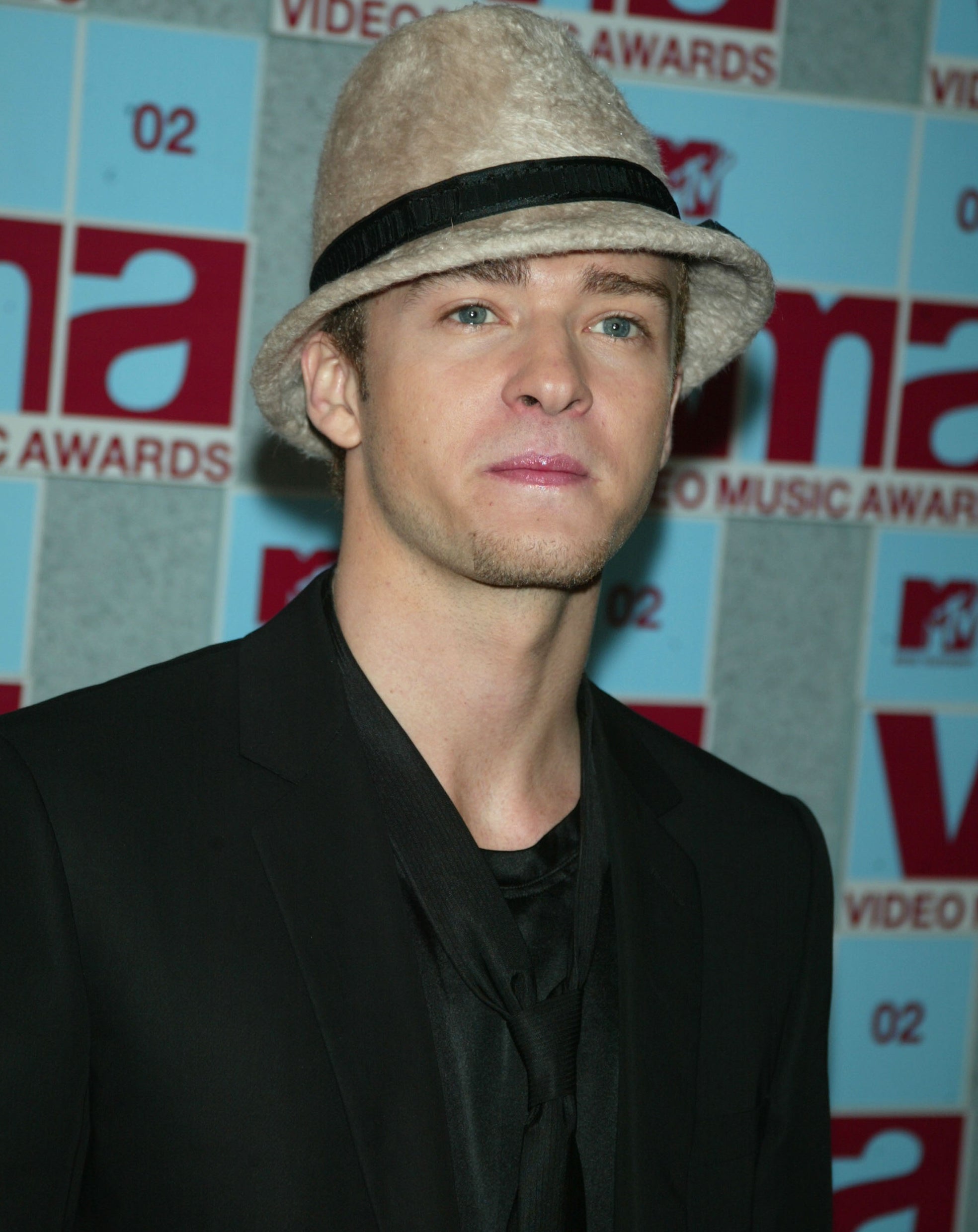 Close-up of Justin wearing a thin-brimmed hat