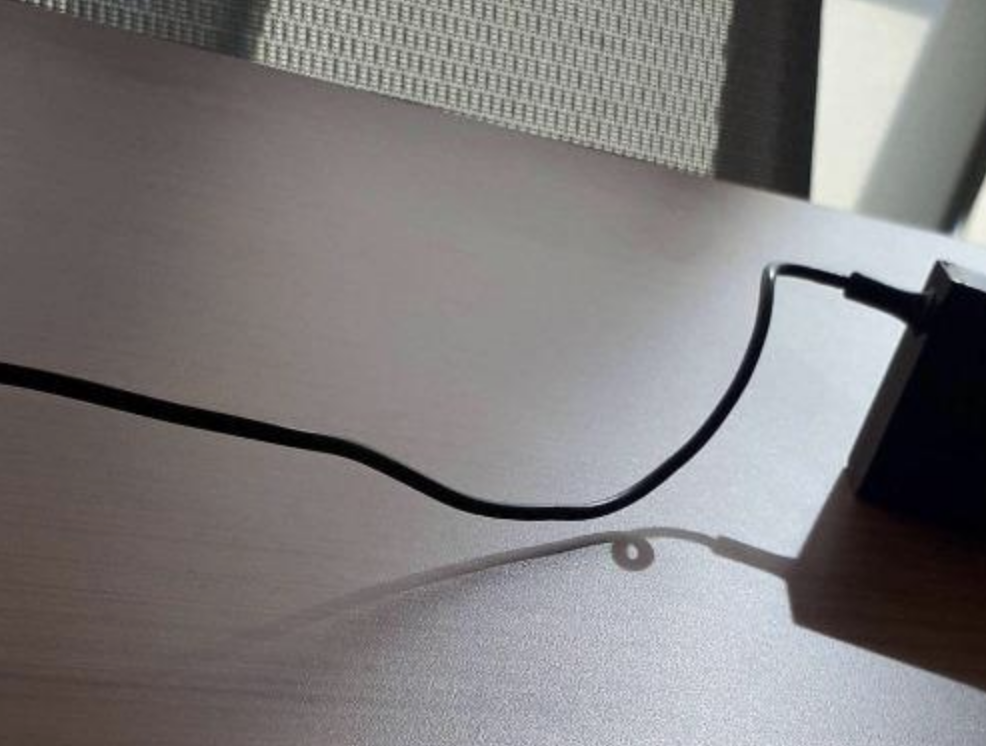 A strange shadow of a cord