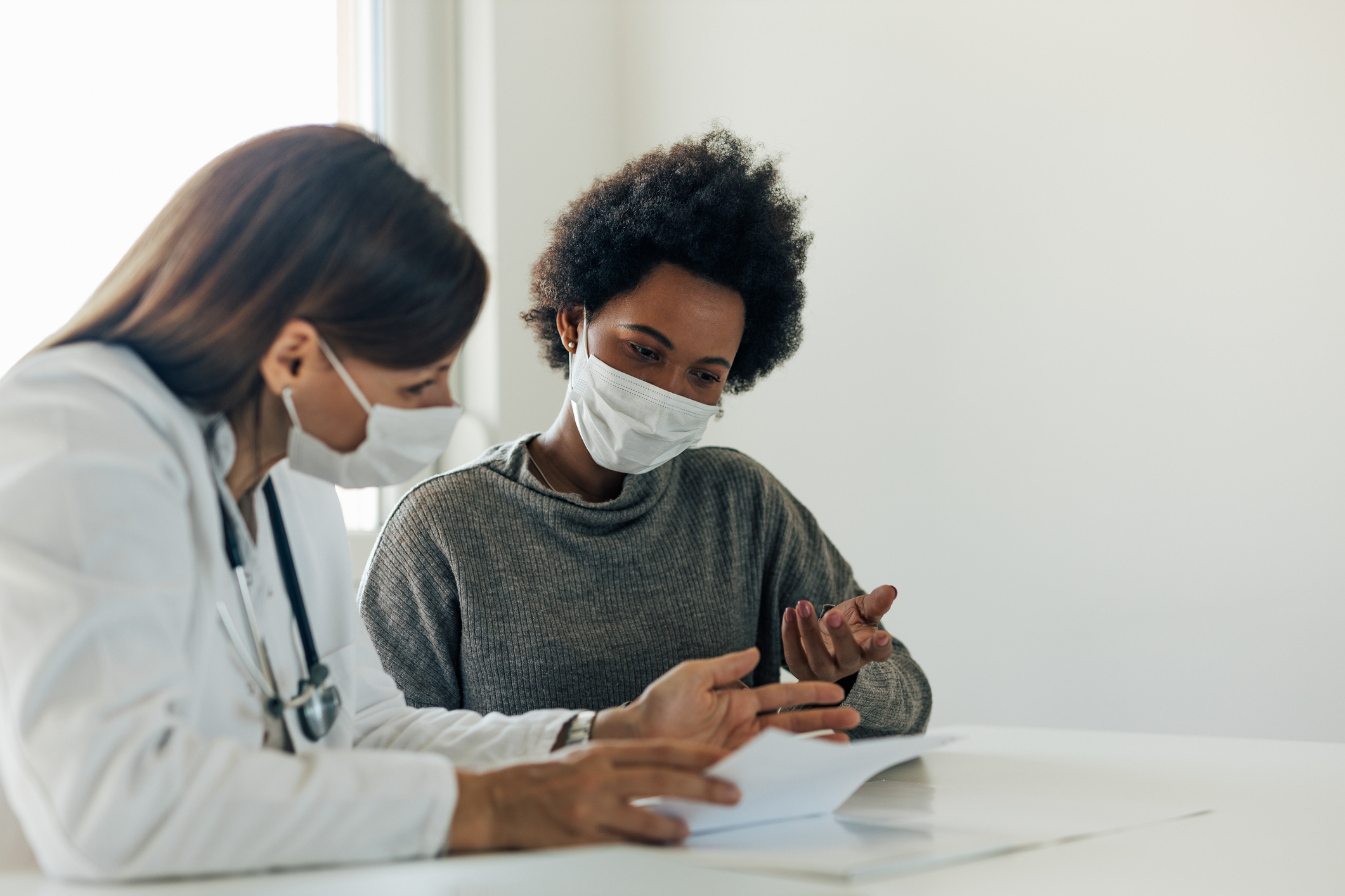 A woman discussing something important with her doctor