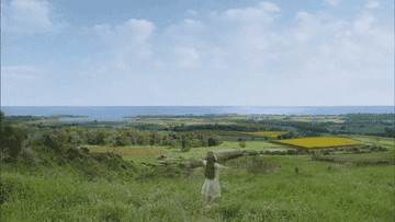 Anne of Green Gables spins in a field in PEI.