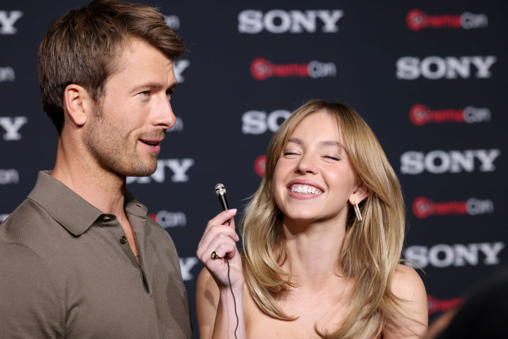 Glen and Sydney smiling at a media event