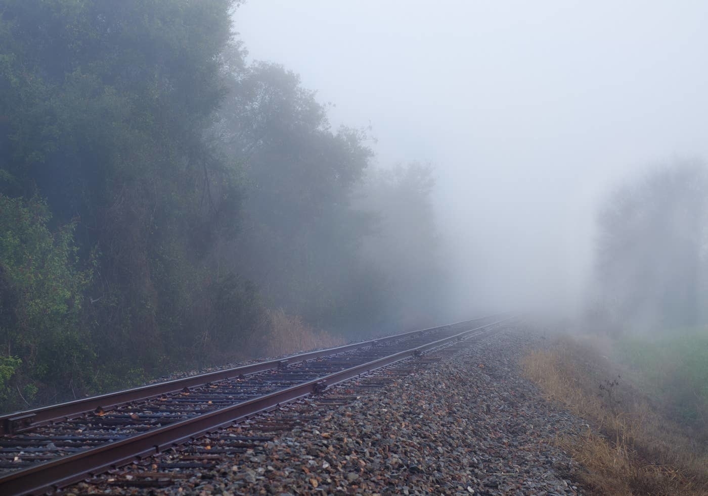 Railway goes into a fog ahead.