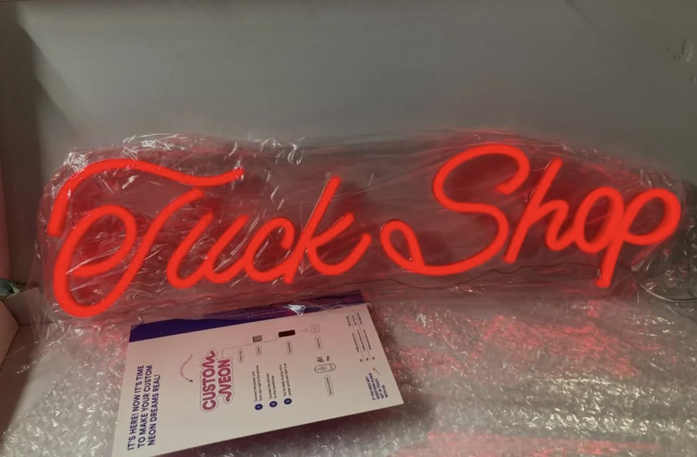 Neon &quot;tuck shop&quot; sign