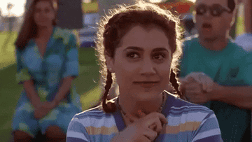 gif of Brittany Murphy as Tai Fraser swooning in the movie &quot;Clueless&quot;