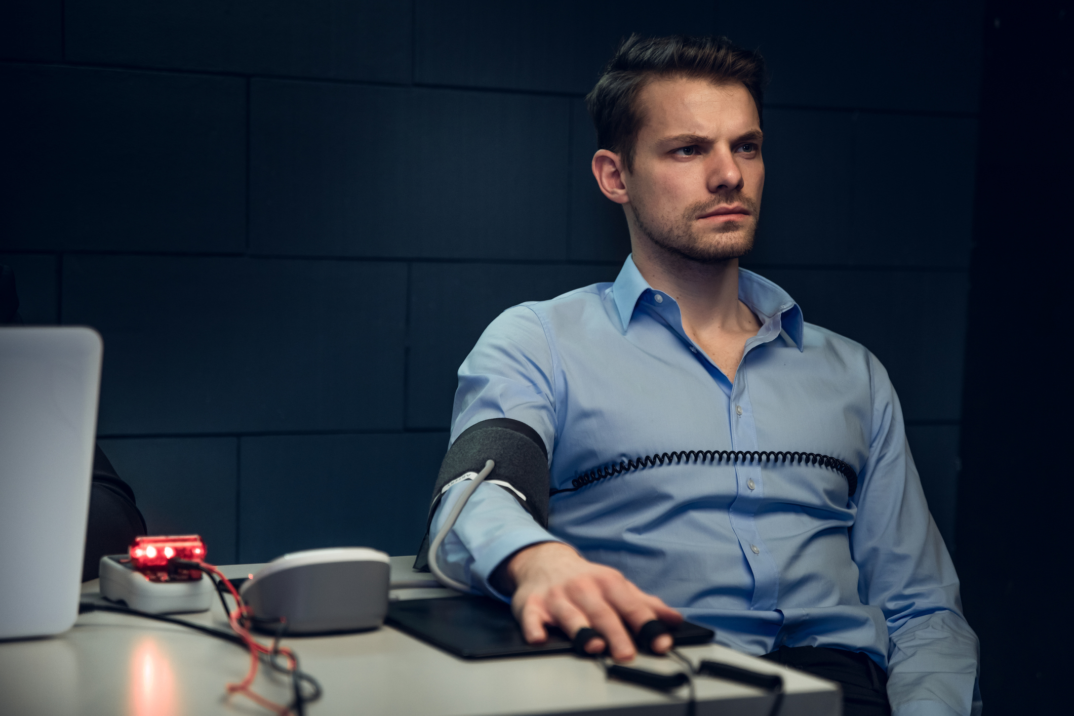A man strapped to a lie detector test