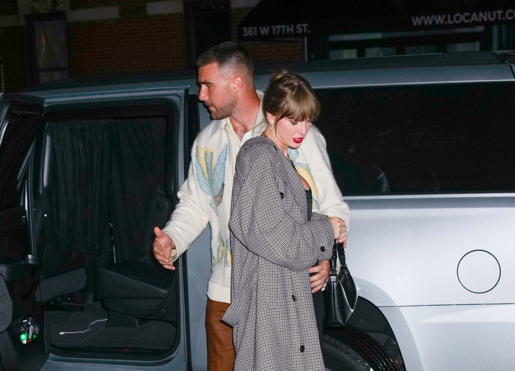 Taylor and Travis exiting a car