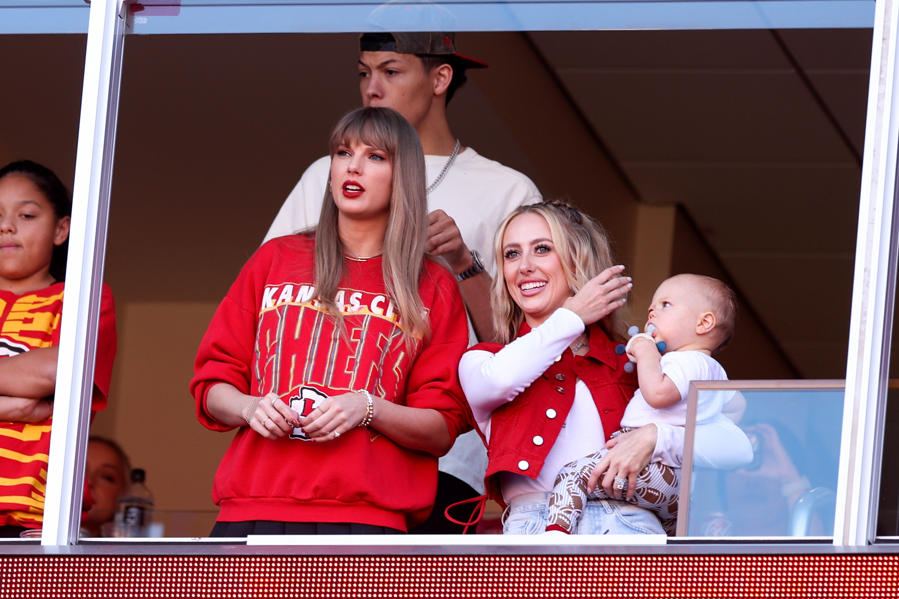 Close-up of Taylor in the VIP lounge with Brittany Mahomes