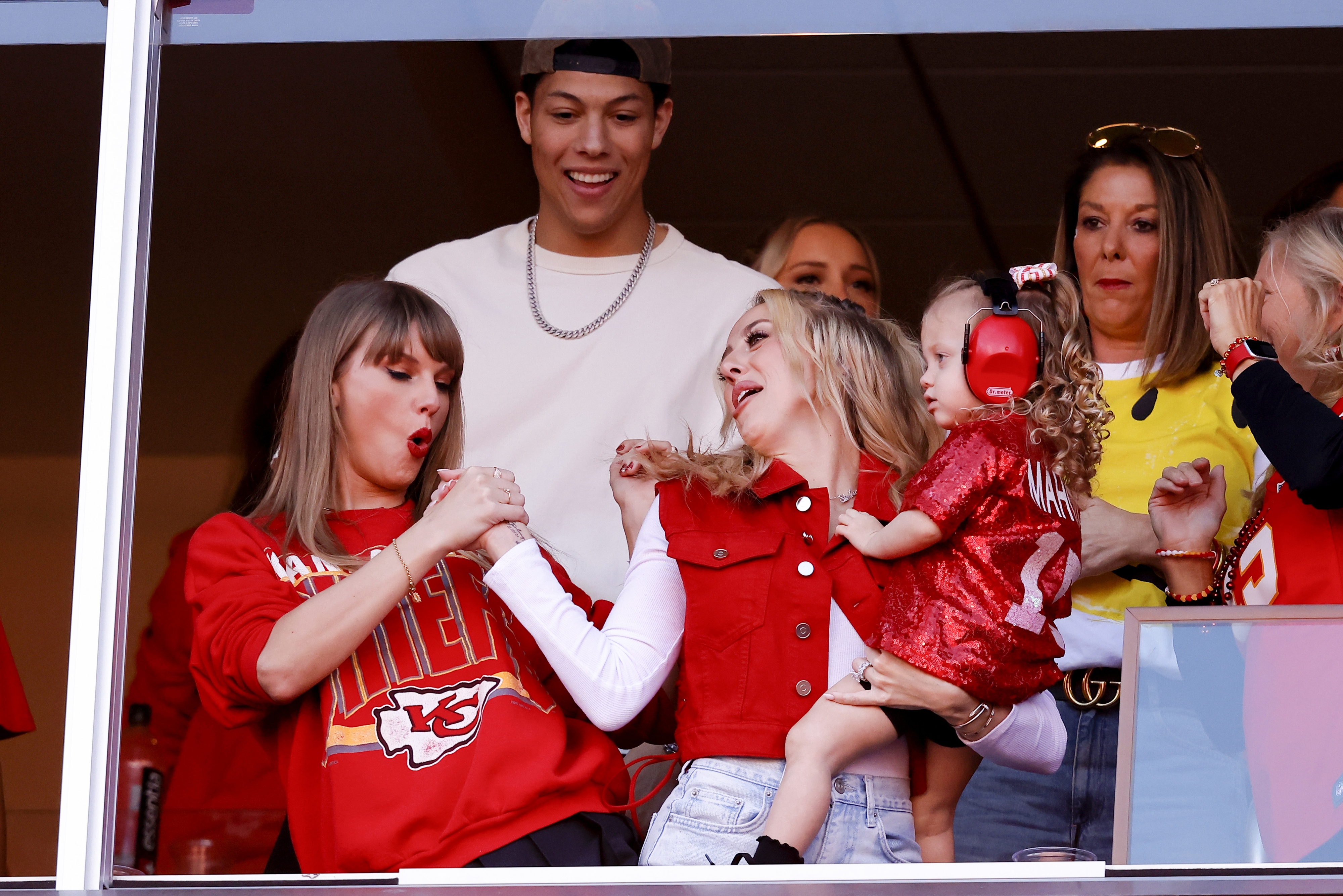 Close-up of Taylor and Brittany clasping hands