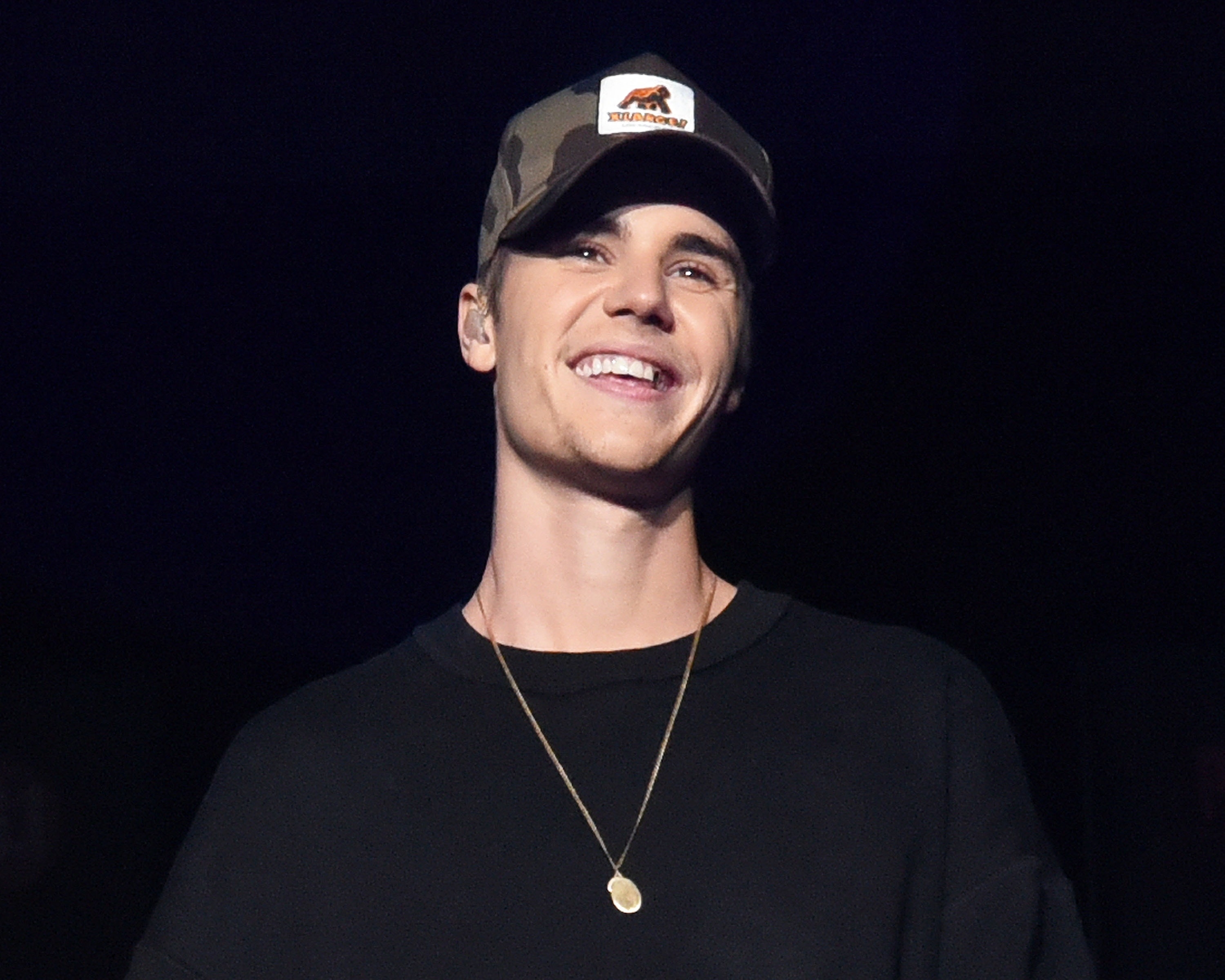 Close-up of Justin smiling as an adult