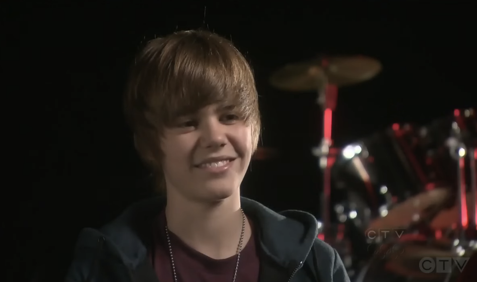 Close-up of Justin grinning in the video