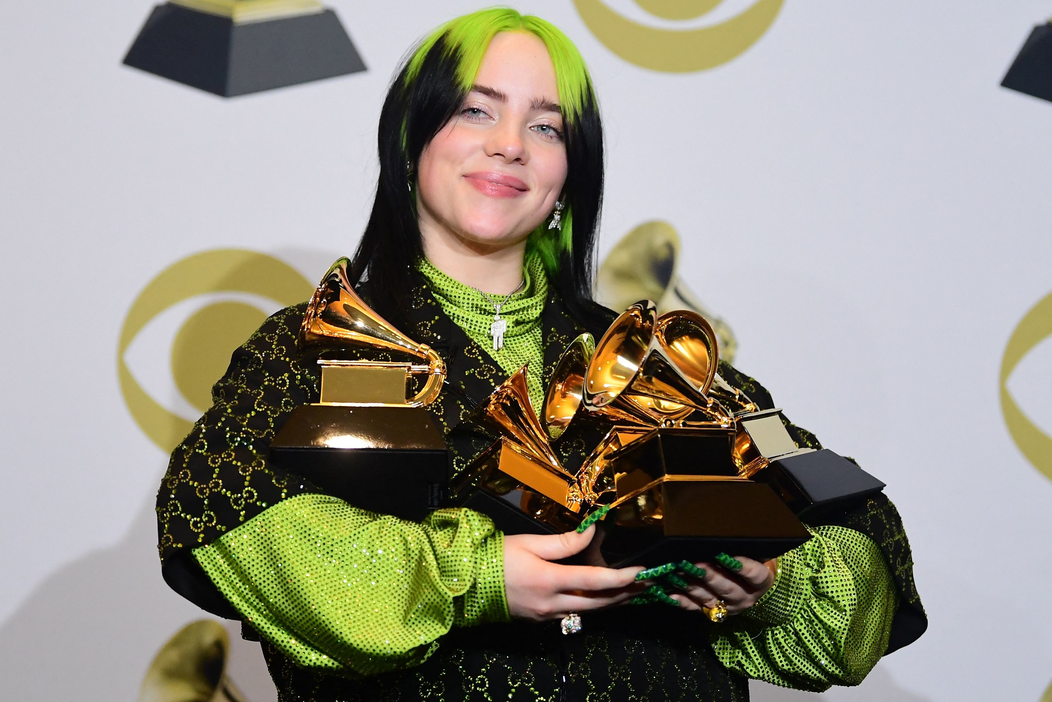 Billie holding her Grammys